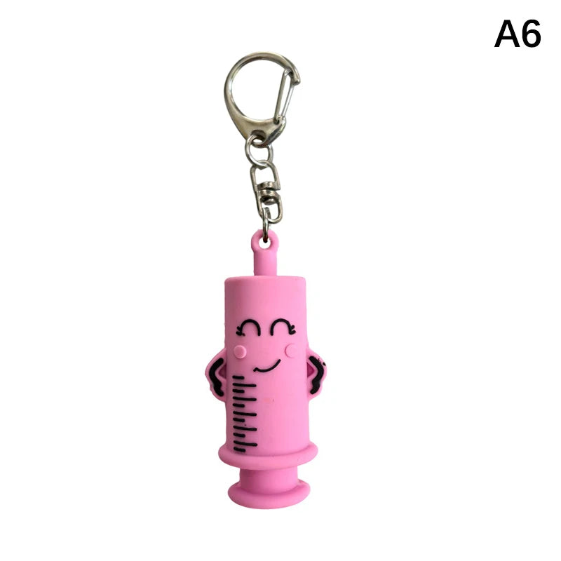 Ouvre-ampoule en forme de seringue avec porte-clés