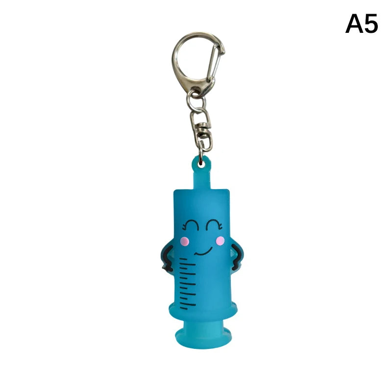Ouvre-ampoule en forme de seringue avec porte-clés
