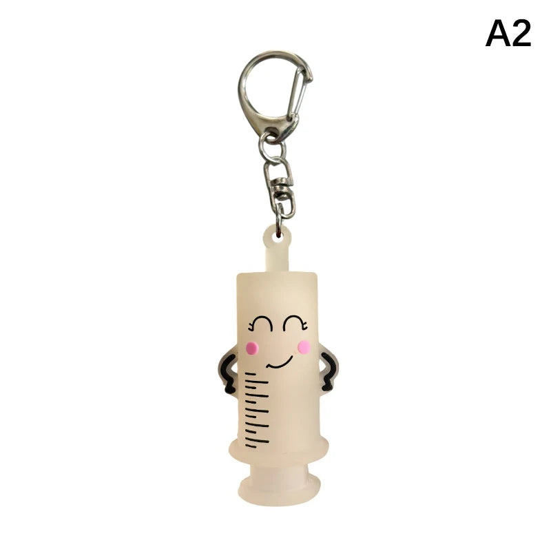 Ouvre-ampoule en forme de seringue avec porte-clés